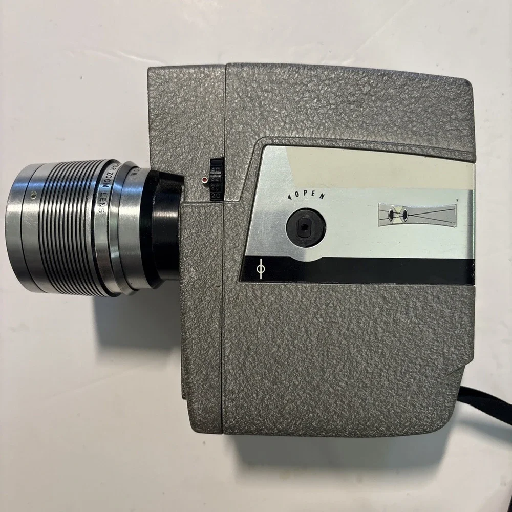The Revere Model 118D Eye Matic 8mm Movie Camera Power Zoom Telephoto Wide Angle